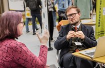 Exhibitor talking to visitors