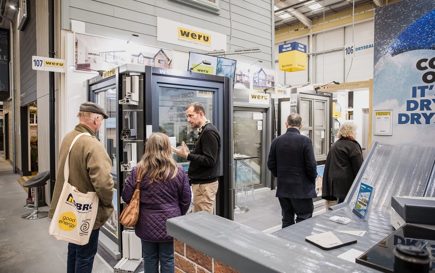 Visitors looking at Trade Village stand