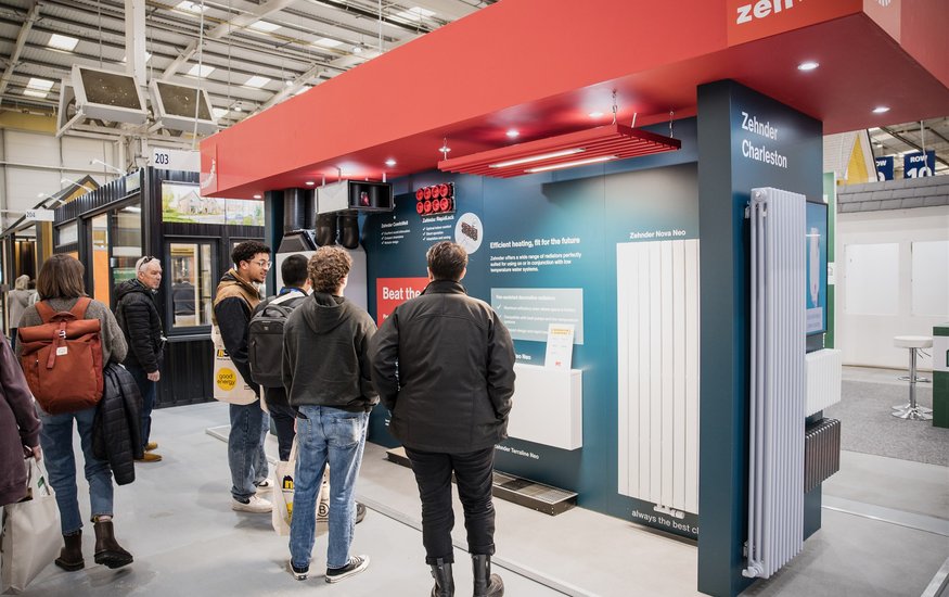 Visitors looking at Trade Village stand