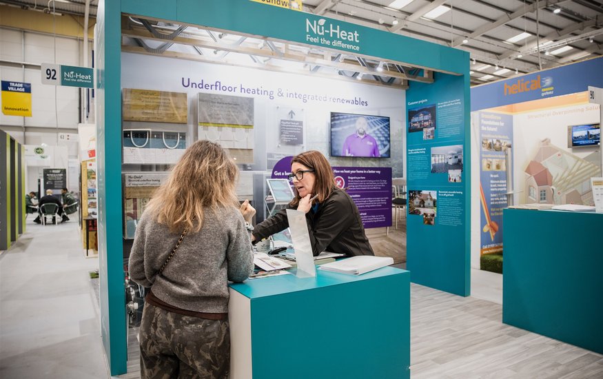 Visitors looking at Trade Village stand